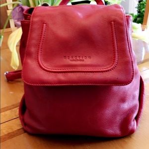 Cranberry red Kenneth Cole leather backpack purse.